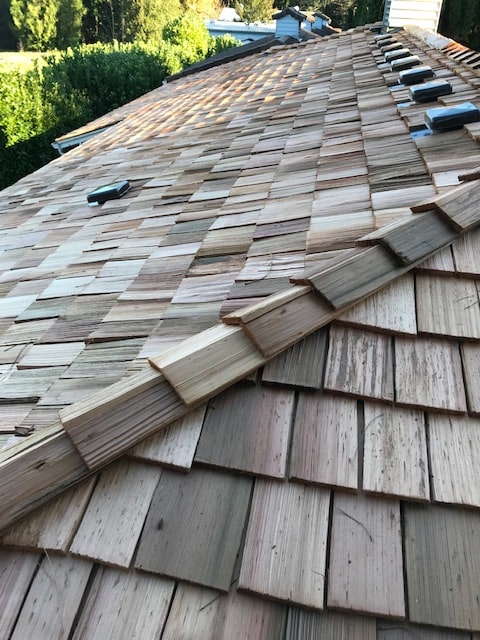 Roof Work - New shake Roofing on a home to illustrate Wood Shakes.