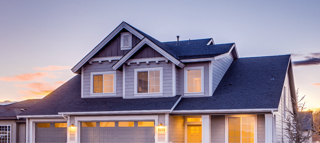 House at dusk Warner Roofing