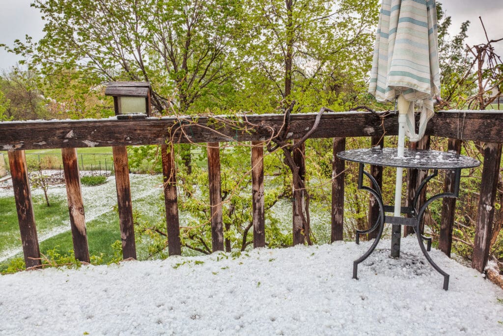 hailstones covering patio and backyard after spring storm