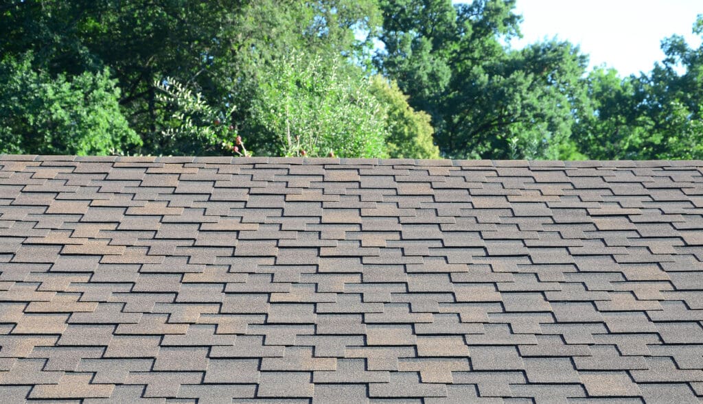 A picture of a new roof with gray shingles to illustrate Is a partial roof replacement a good idea?