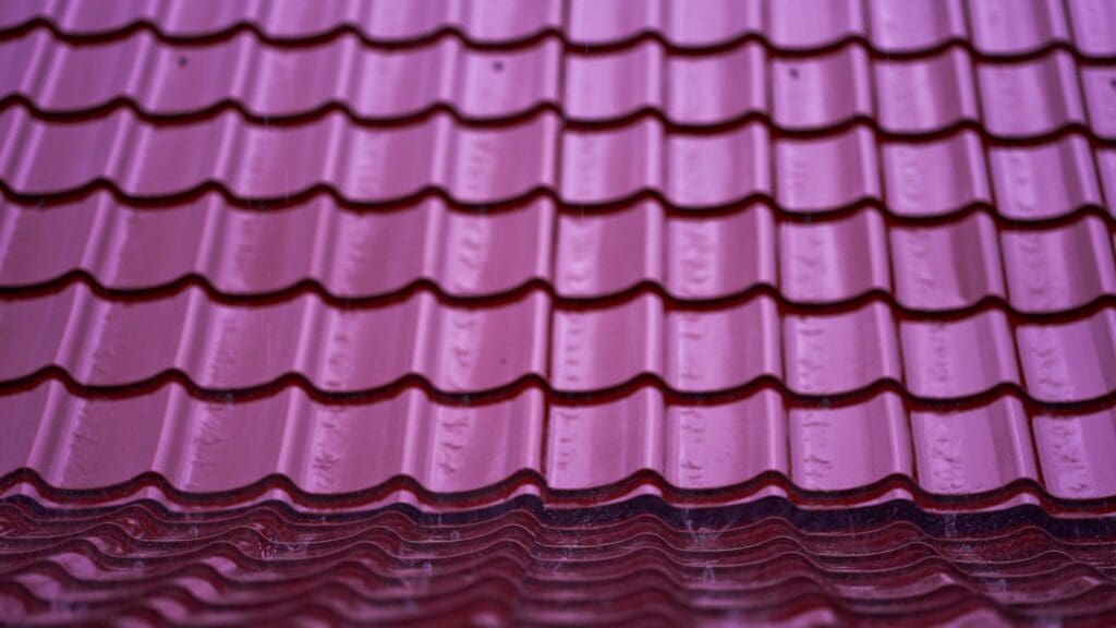 Stacks of purple zinc roofing tiles to illustrate Types Of Metal Roofs Durable, Stylish Choices for Any Home