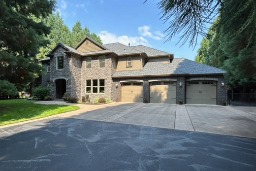 an example of a home with a mix of gable and hip roof to help illustrate different residential types of roofs.