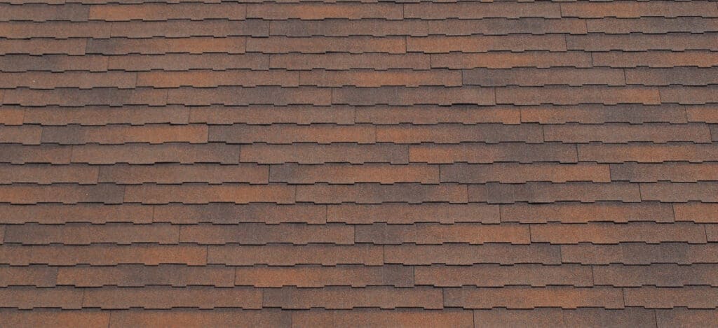 A red roof using composition shingles to illustrate what are composition shingles.