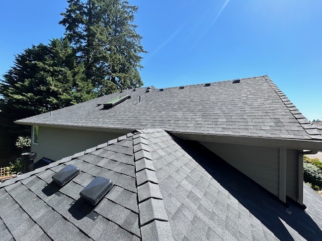 A new gray shingle roof on a home.