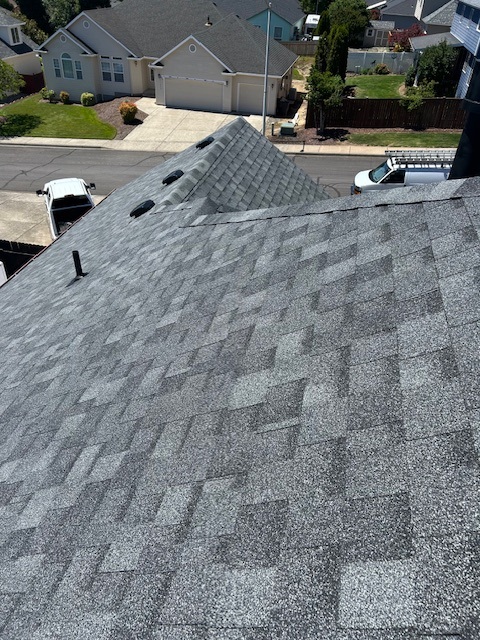 An image of gray house shingle roofing.