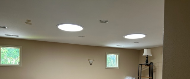 A dark room that now has light after installing a solar tube.