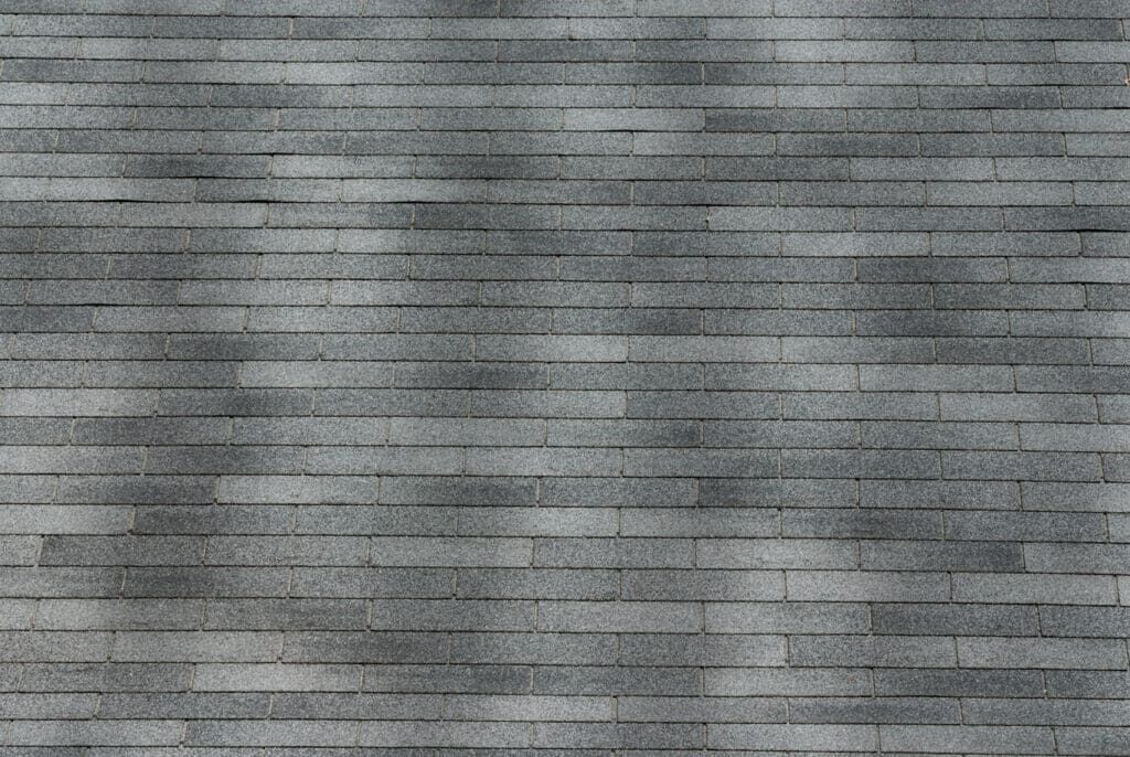 Gray shingles on a roof to help illustrate roof inspection services