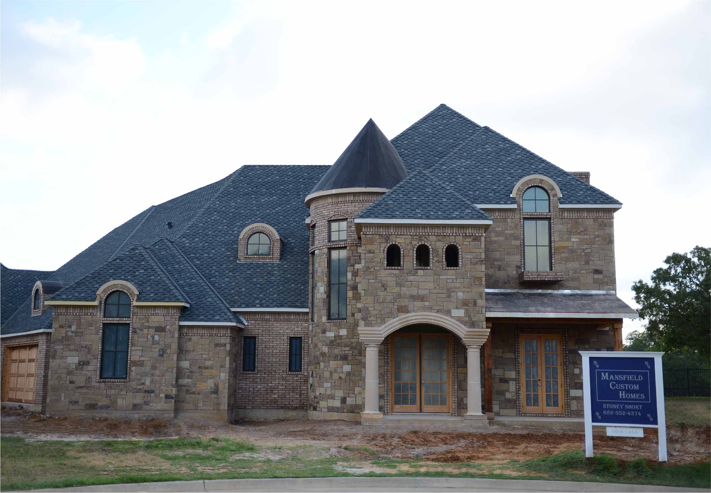 Front view of two story home with new roof installation of Pabco Roofing Products