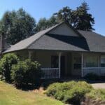 A modern residential home with a new roof installation