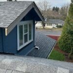 new roof installation on two story home with composite shingles