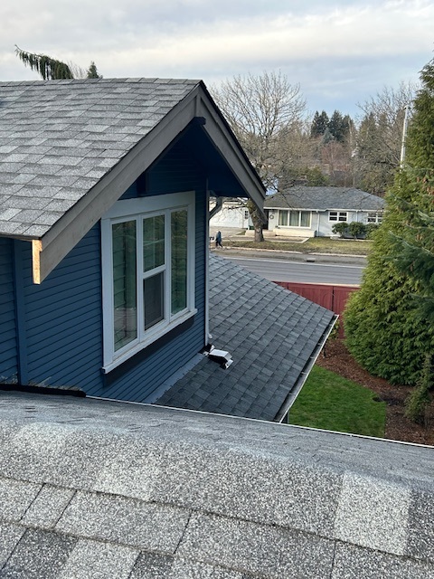 new roof installation on two story home with composite shingles