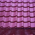 Stacks of purple zinc roofing tiles to illustrate Types Of Metal Roofs Durable, Stylish Choices for Any Home