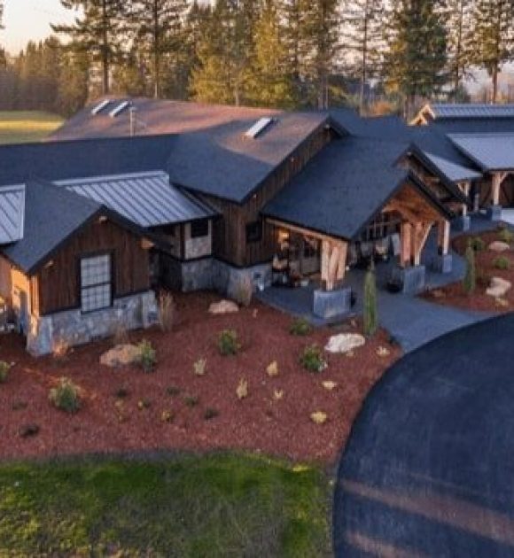 A large estate with different roofing materials (metal, composite shingles) to illustrate custom roofing.