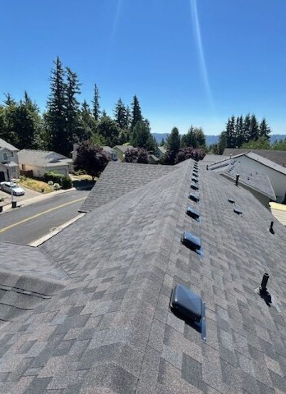 A look at a new roof using gray shingles with plenty of venting to help illustrate roof replacements.