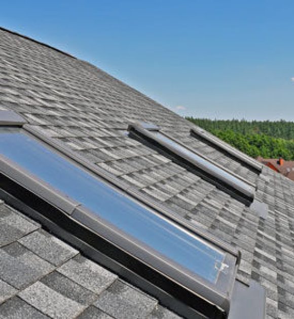 Images of three skylights on a roof to help illustrate Skylight repair and custom roofing