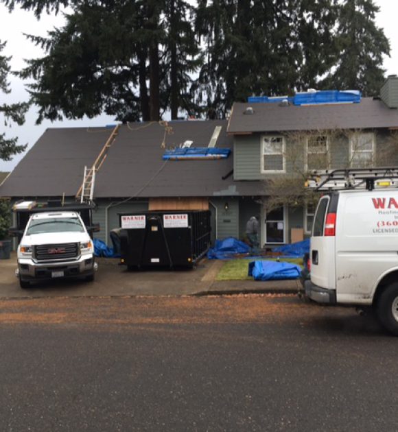 roof portfolio image with Warner Roofing van in front of a home to illustrate types of residential roofs and roof repair