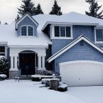 A snow covered home to illustrate Winter roof maintenance tips